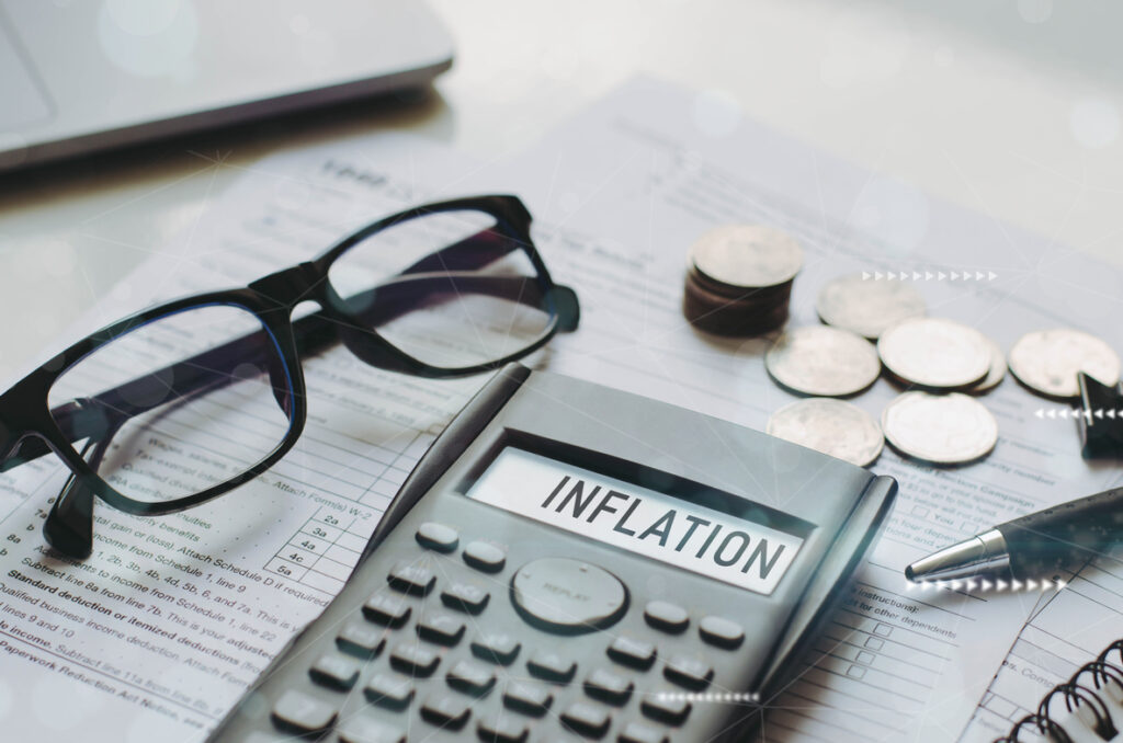 Inflation word on calculator with interest rate hike considerati